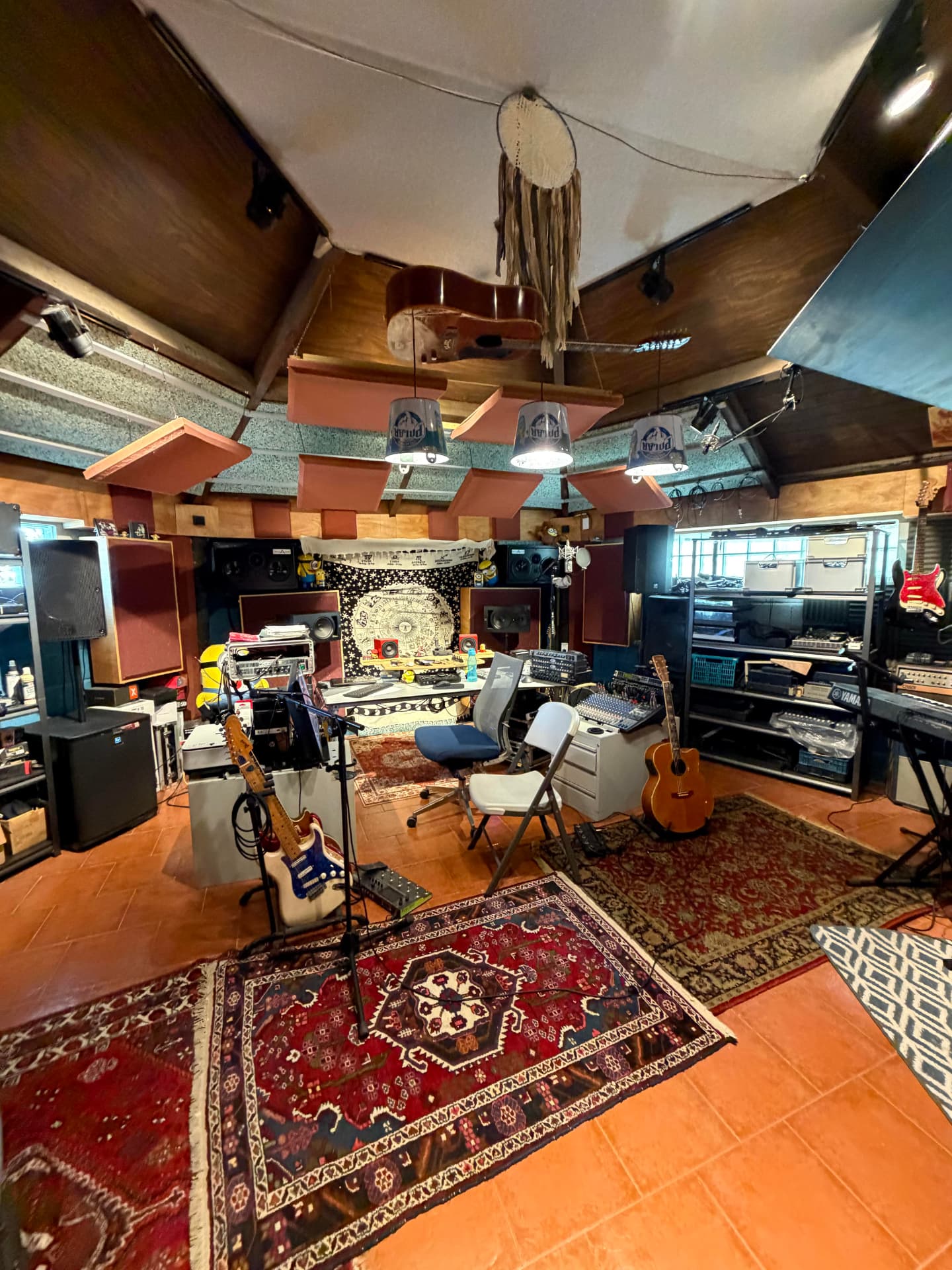 The Triple R Studio control room with desks, guitars and rugs