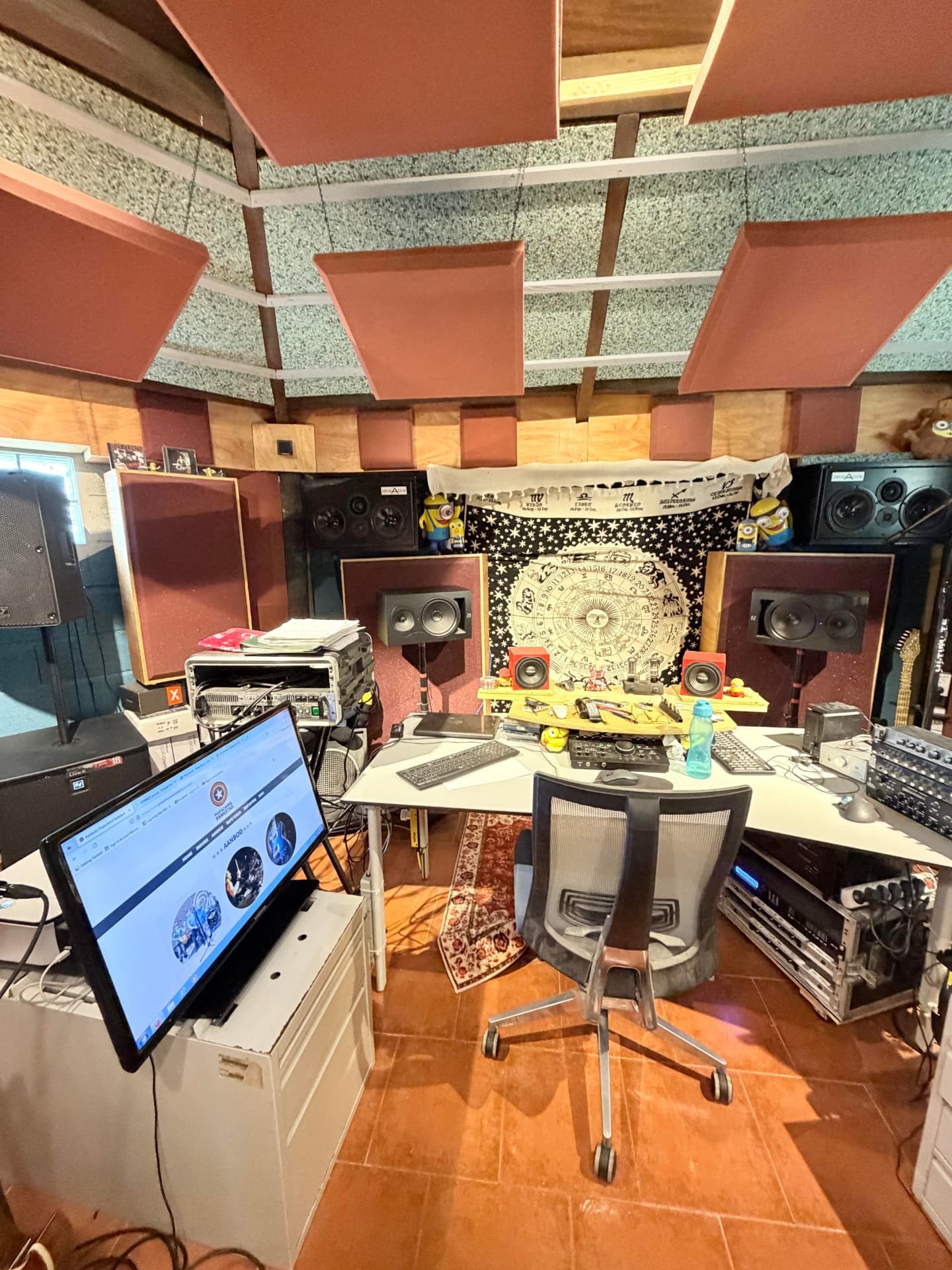 Mixing desk and studio monitors at the control position
