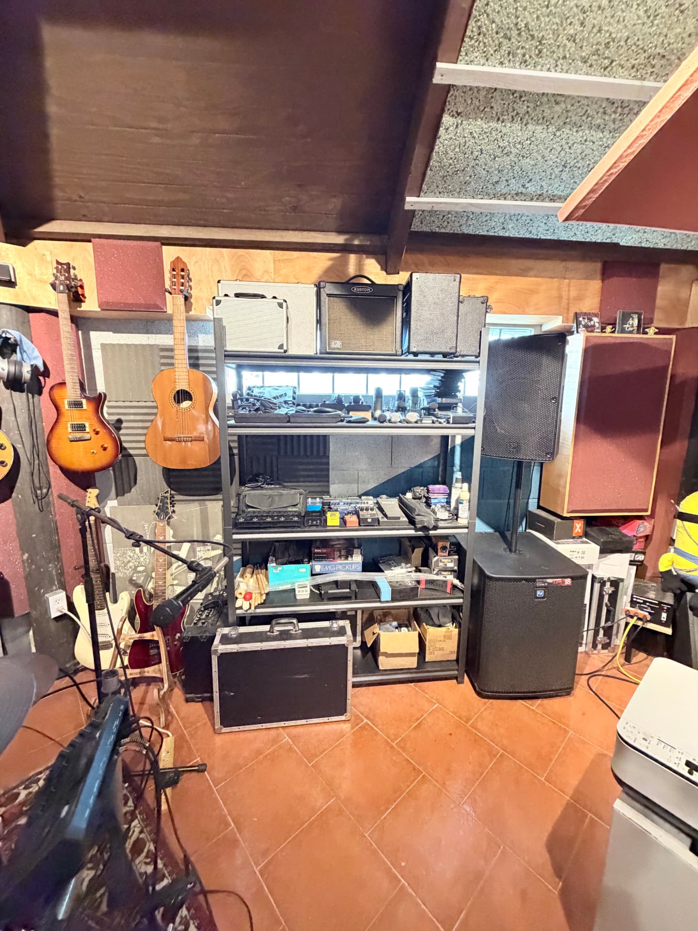 Amps, pedals and gear racks in the studio